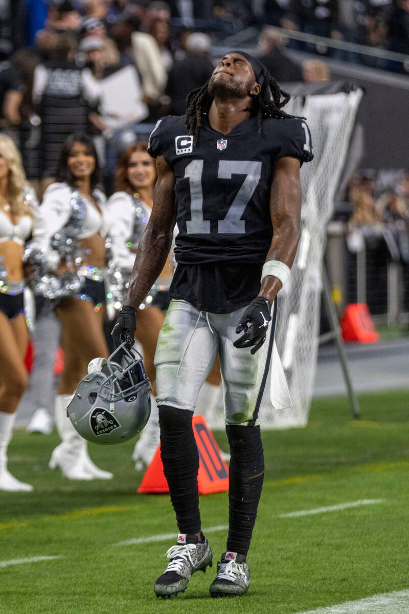 Las Vegas Raiders wide receiver Davante Adams (17) reacts on the sideline after a pass intended ...