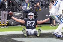 Raiders tight end Foster Moreau (87) poses after scoring a touchdown against the Indianapolis C ...