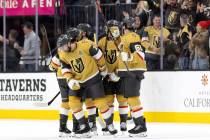 The Golden Knights celebrate after defenseman Alex Pietrangelo (7) scored a goal during the sec ...