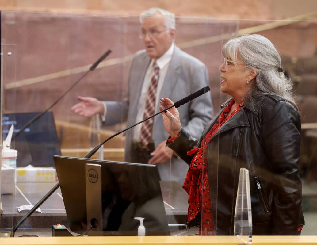 Ed Uehling and Lisa Mayo DeRiso speak at the same time during a commission meeting at the Clark ...