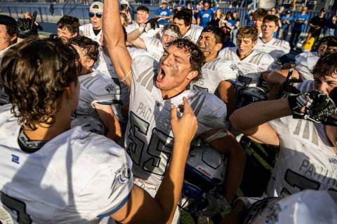 Pahranagat Valley’s Jacob Griffin (55) celebrates with teammates after beating Eureka during ...