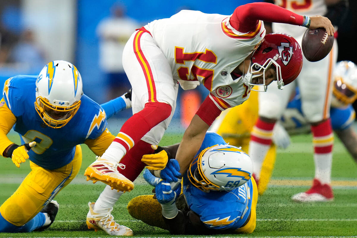 Los Angeles Chargers defensive tackle Sebastian Joseph-Day, right, and linebacker Kyle Van Noy, ...