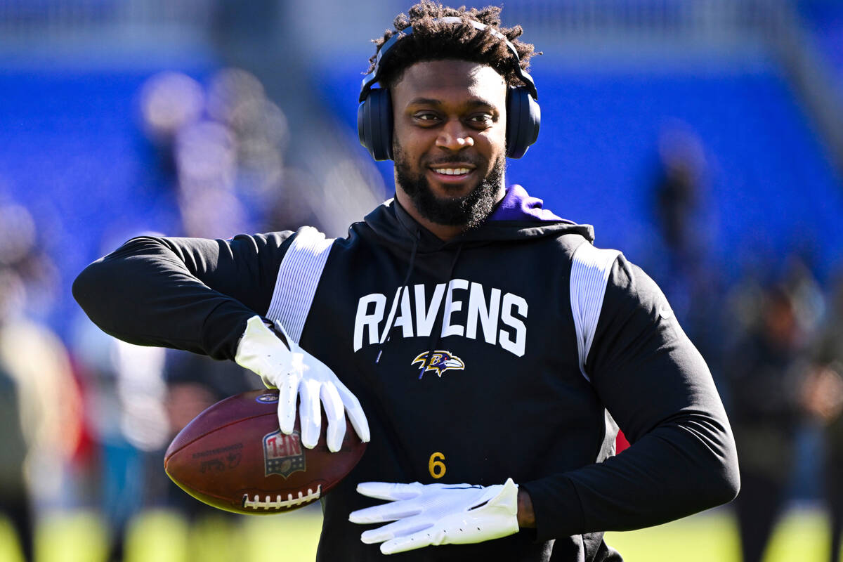 Baltimore Ravens linebacker Patrick Queen looks on during pre-game warm-ups before an NFL footb ...