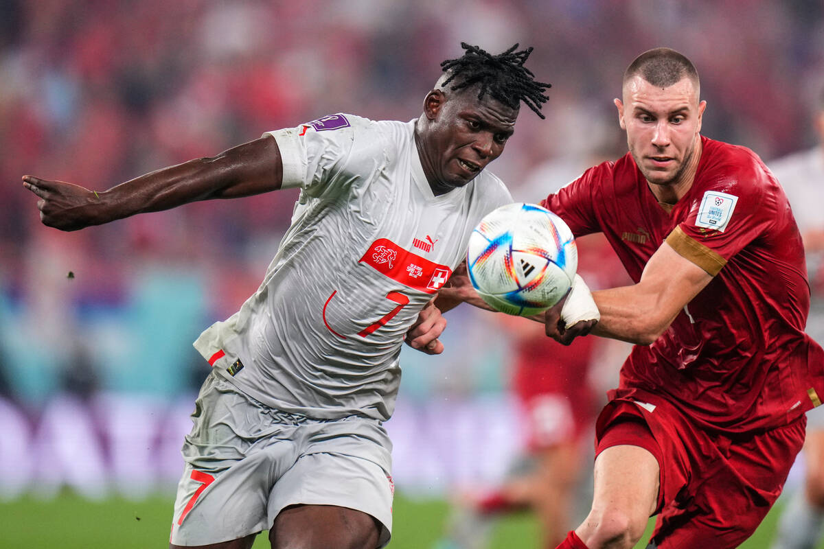 Switzerland's Breel Embolo, left, fights for the ball with Serbia's Strahinja Pavlovic during t ...