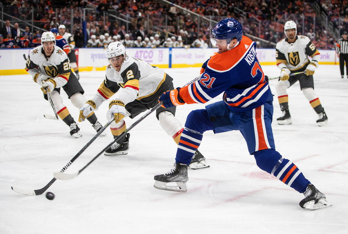 Vegas Golden Knights' Zach Whitecloud (2) blocks the shot from Edmonton Oilers' Klim Kostin (21 ...