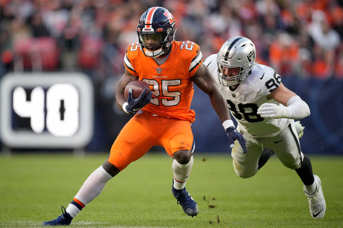 Denver Broncos running back Melvin Gordon III (25) runs against Las Vegas Raiders defensive end ...