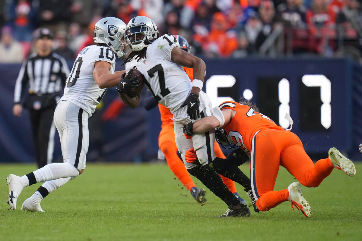 Las Vegas Raiders wide receiver Davante Adams (17) runs against the Denver Broncos during the s ...