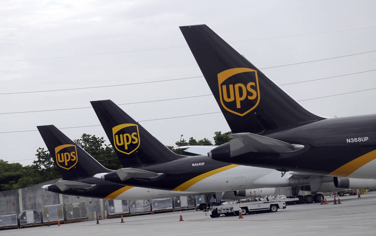In this July 27, 2020 file photo, the tails of three UPS aircraft are shown parked at Miami Int ...