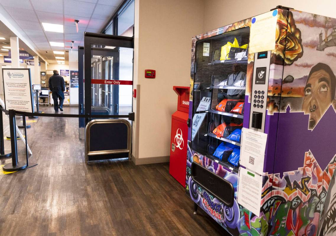 A new public health vending machine and used syringe disposal bin are displayed, as part of an ...