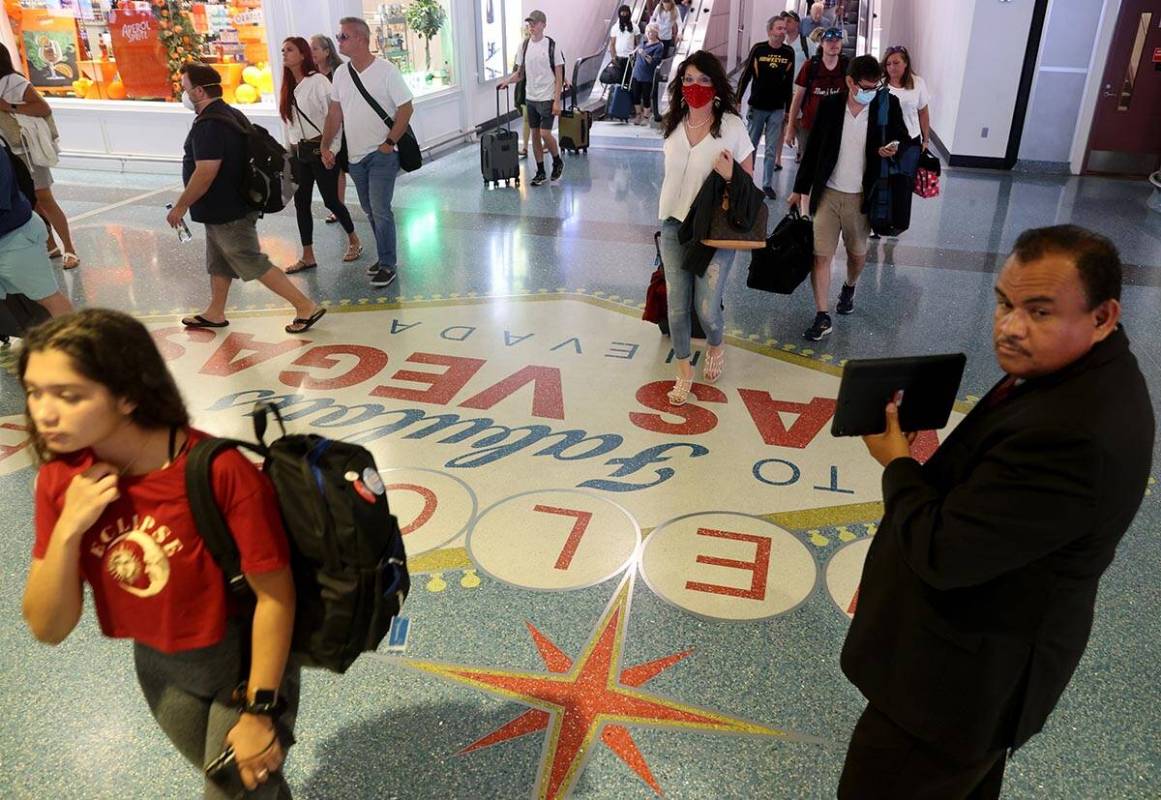 Passengers in baggage claim in Terminal 1 at Harry Reid International Airport on Wednesday, Jun ...