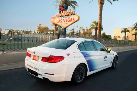 An autonomous Motional BMW 5 Series vehicle part of the Lyft program passes the Welcome to Las ...