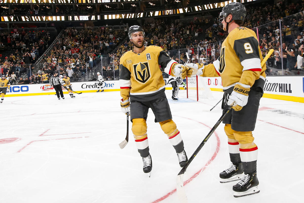 Golden Knights center Jack Eichel (9) celebrates his goal against the Los Angeles Kings with de ...