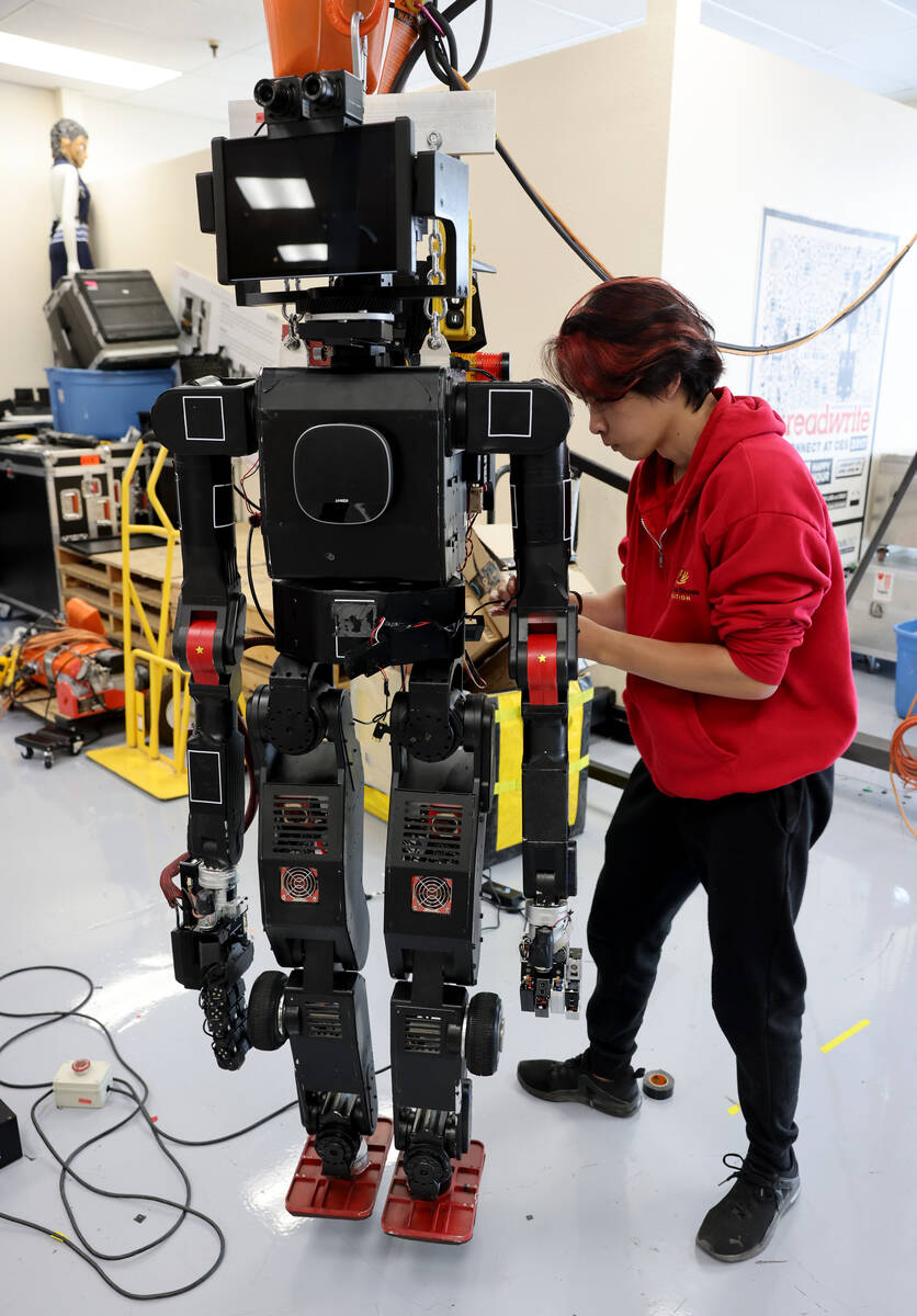 UNLV undergraduate research student Son Tran works on a robot in his lab in Las Vegas on Monday ...