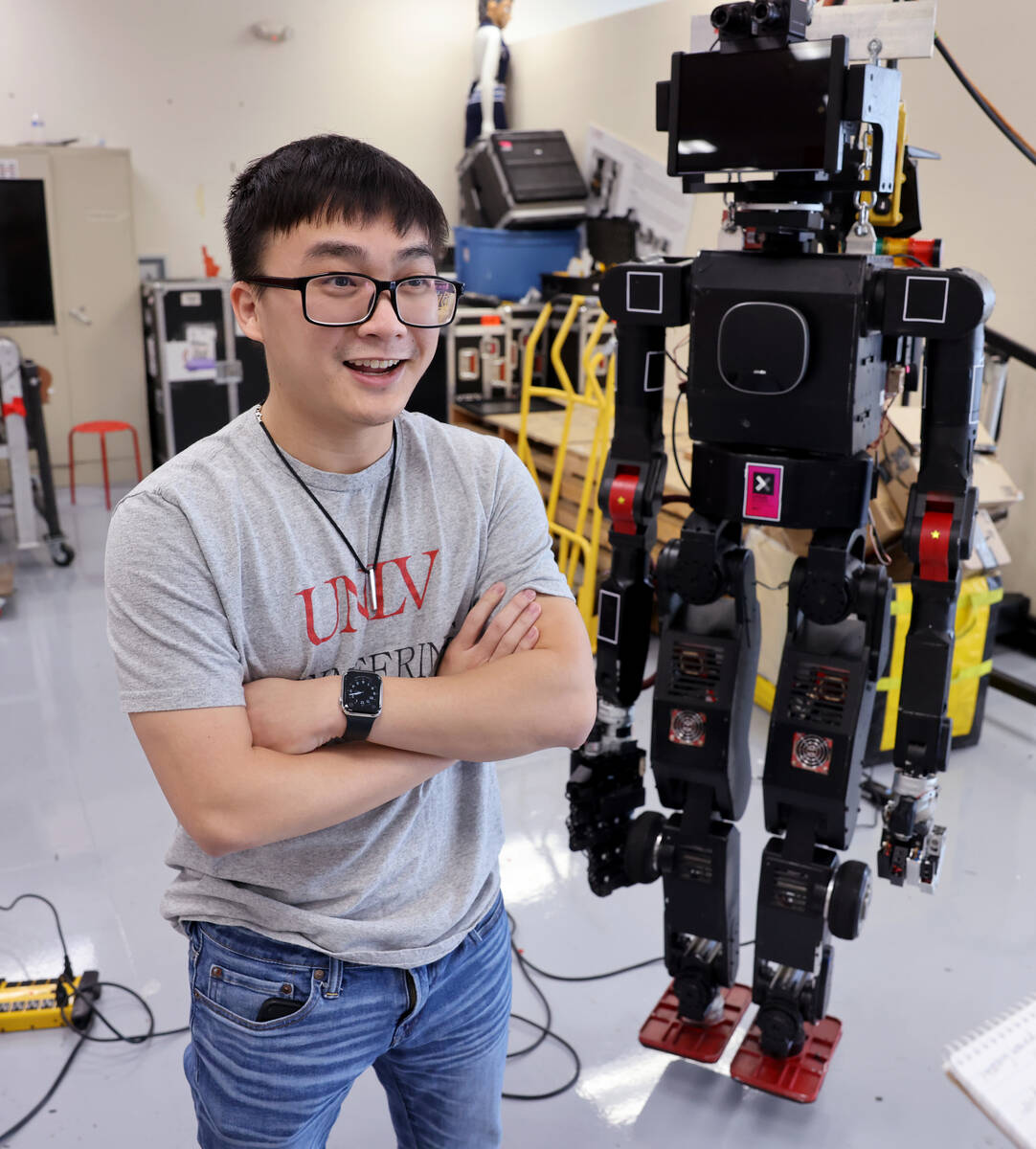UNLV mechanical engineering grad student Truc Tran with a robot in his lab in Las Vegas on Mond ...