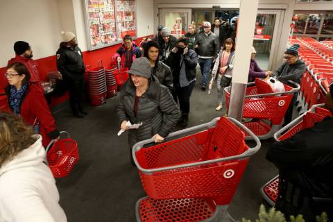 Shoppers file in for the 6 p.m. opening of Target at Maryland Parkway and Flamingo Road for ear ...