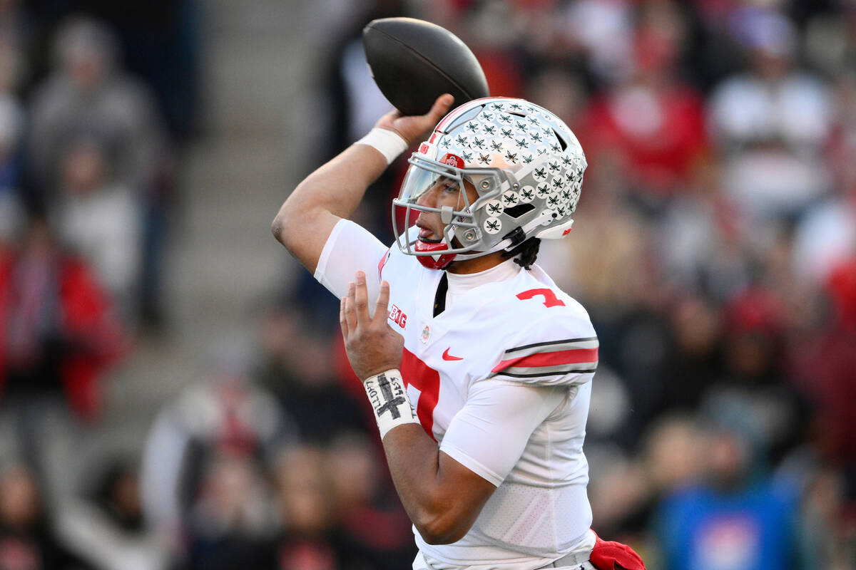 Ohio State quarterback C.J. Stroud (7) passes during the first half of an NCAA college football ...