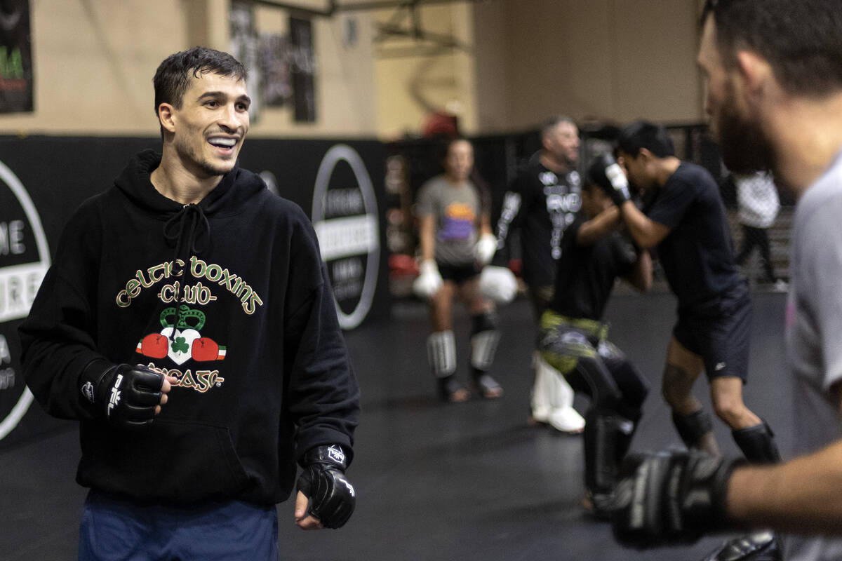 MMA fighter Biaggio Ali Walsh, grandson of legendary boxer Muhammad Ali, laughs while sparring ...