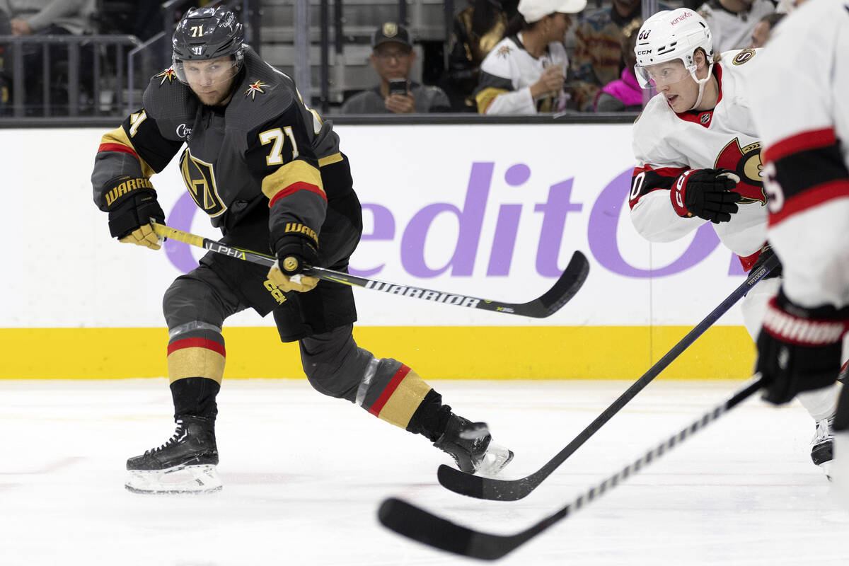 Golden Knights center William Karlsson (71) shoots a goal while Senators defenseman Lassi Thoms ...