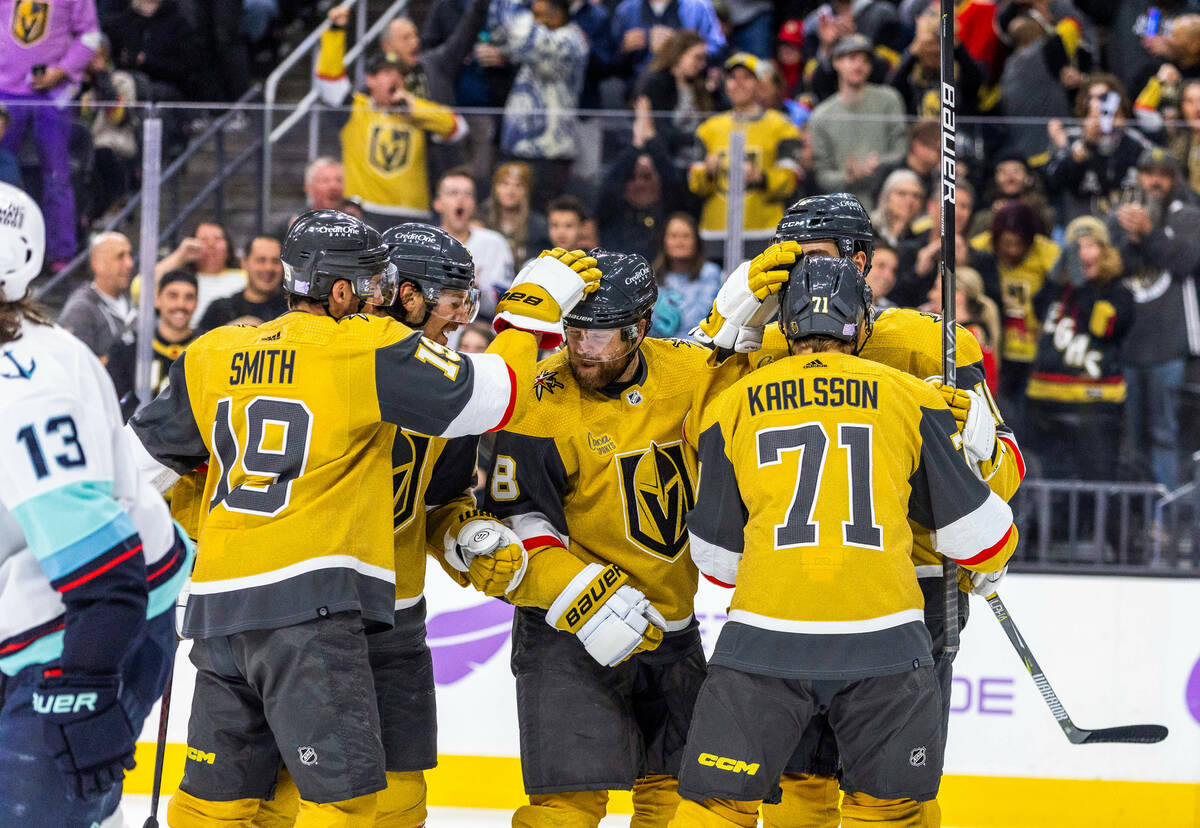 Golden Knights center Phil Kessel (8) and teammates celebrate a score over the Seattle Kraken d ...