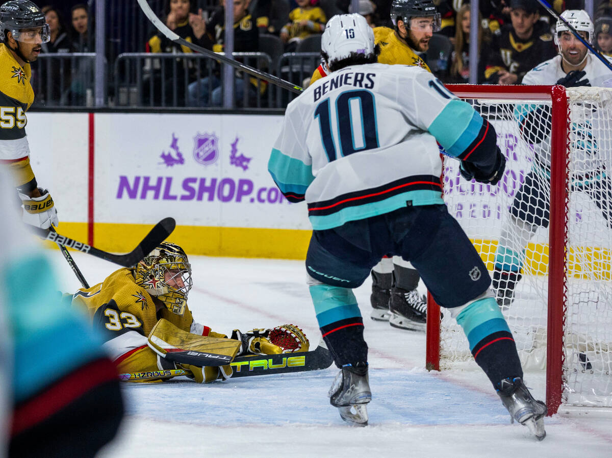 Golden Knights goaltender Adin Hill (33) watches from the ice as the puck goes into the net fro ...