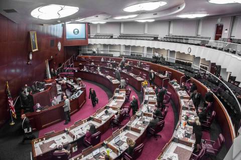 Members of the assembly file out of chambers during the second day of the Nevada Legislative se ...