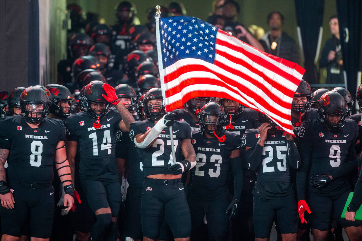UNLV Rebels show their Veteran's Day spirit before facing the Fresno State Bulldogs during the ...