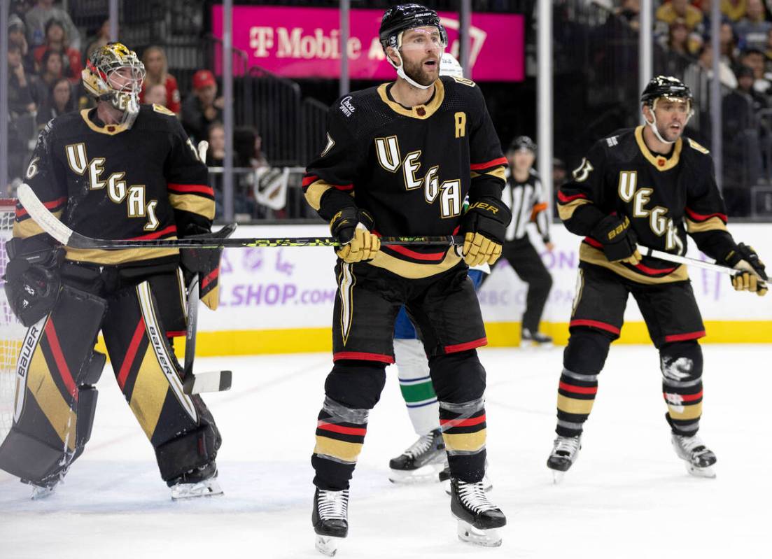 Golden Knights defenseman Alex Pietrangelo (7) reacts to a play flanked by goaltender Logan Tho ...