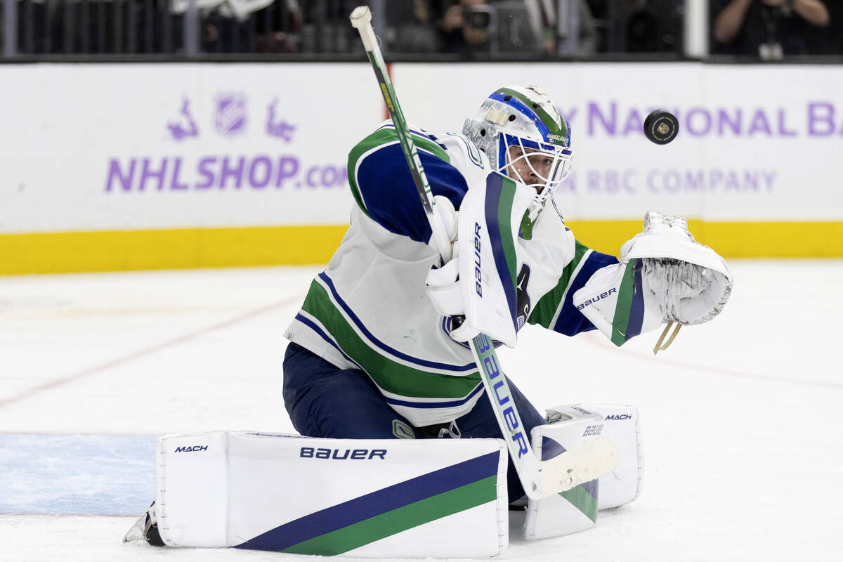 Canucks goaltender Spencer Martin (30) saves a Golden Knights shot on goal during the third per ...