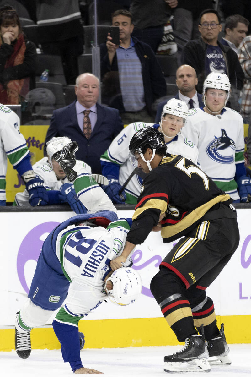 Golden Knights right wing Keegan Kolesar (55) tosses Golden Knights center Jonathan Marchessaul ...