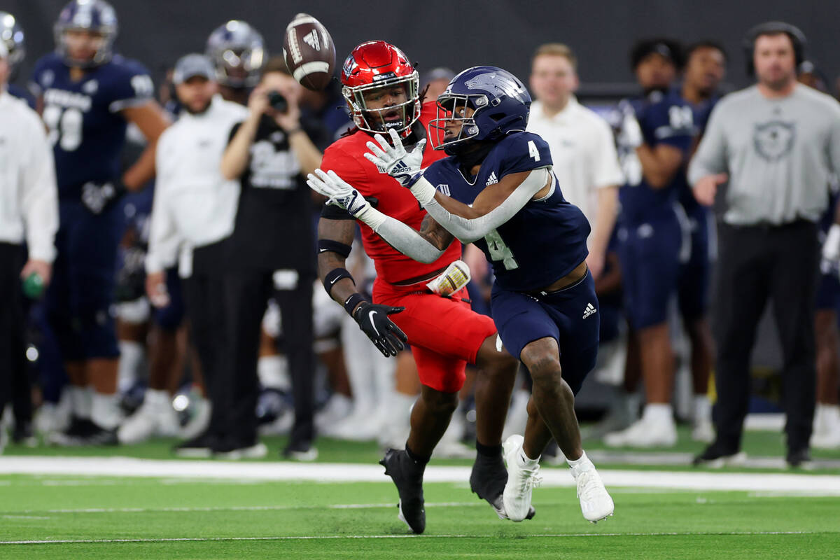 Nevada Wolf Pack wide receiver BJ Casteel (4) makes a catch for a touchdown as UNLV Rebels defe ...
