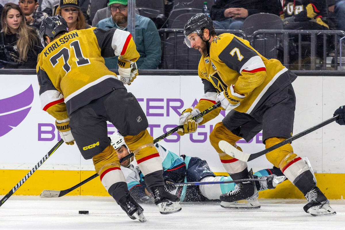 Golden Knights center William Karlsson (71) takes control of the puck after Seattle Kraken righ ...