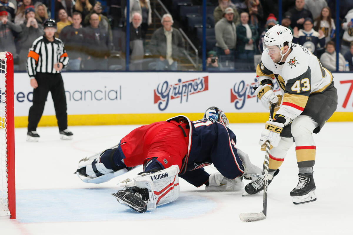 Vegas Golden Knights' Paul Cotter, right, scores against Columbus Blue Jackets' Daniil Tarasov ...