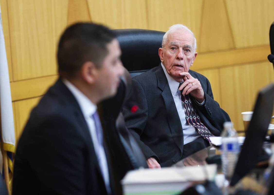 Hearing officer William Jansen listens to Las Vegas Metropolitan Police Department Detective Sc ...