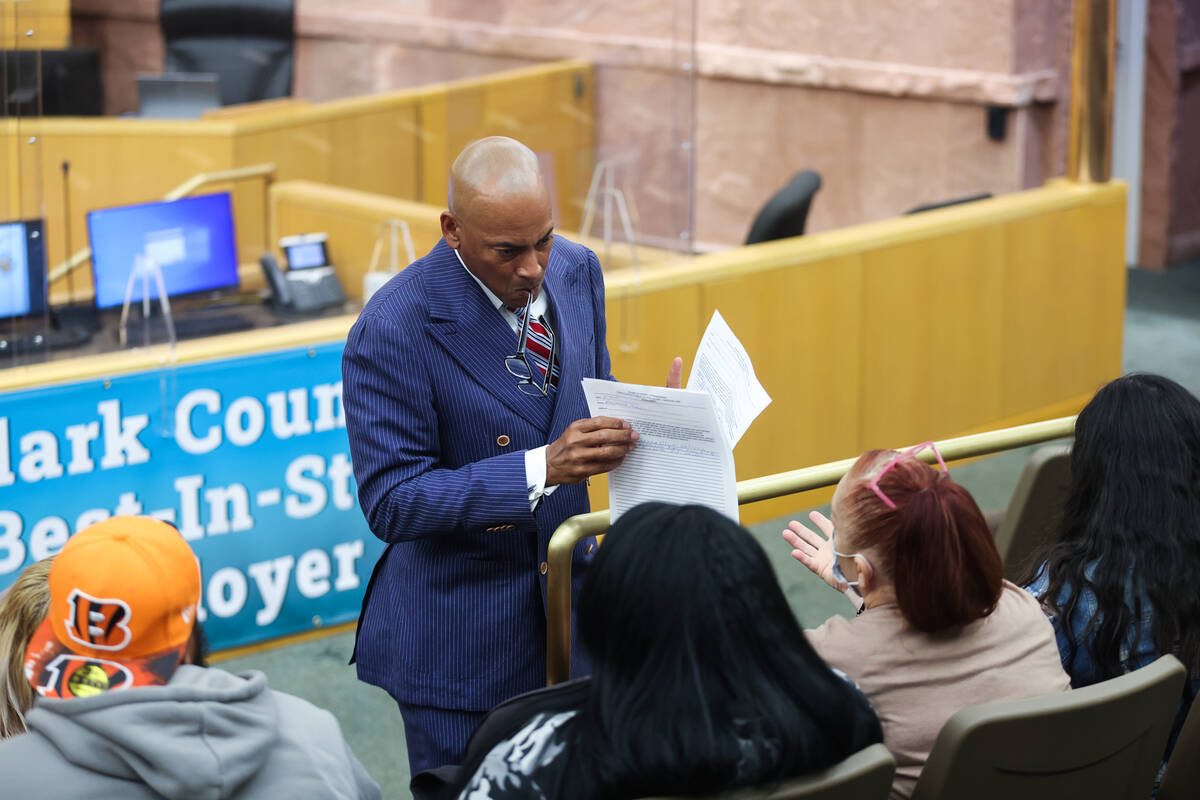 Ombudsman Carl Arnold speaks with the family of victim Demetrius Deshawn Roberts at a fact-find ...