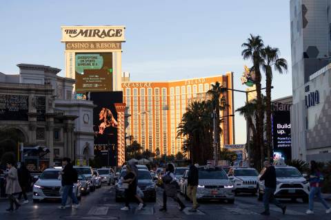 Visitors to the Strip cross Las Vegas Boulevard on Tuesday, Nov. 29, 2022, in Las Vegas. (Ellen ...