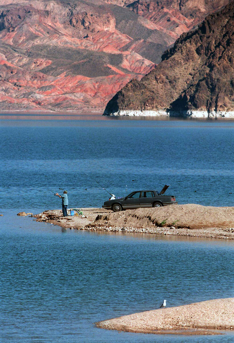 A lone fishermen on the point next to Hemenway Harbor at Lake Mead on Tuesday Feb 11 1997 The b ...