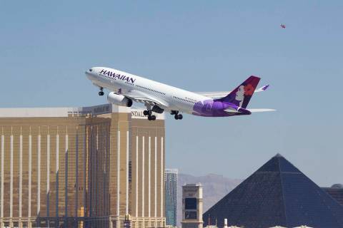 A Hawaiian Airlines jetliner departs from McCarran International Airport in Las Vegas on Wednes ...