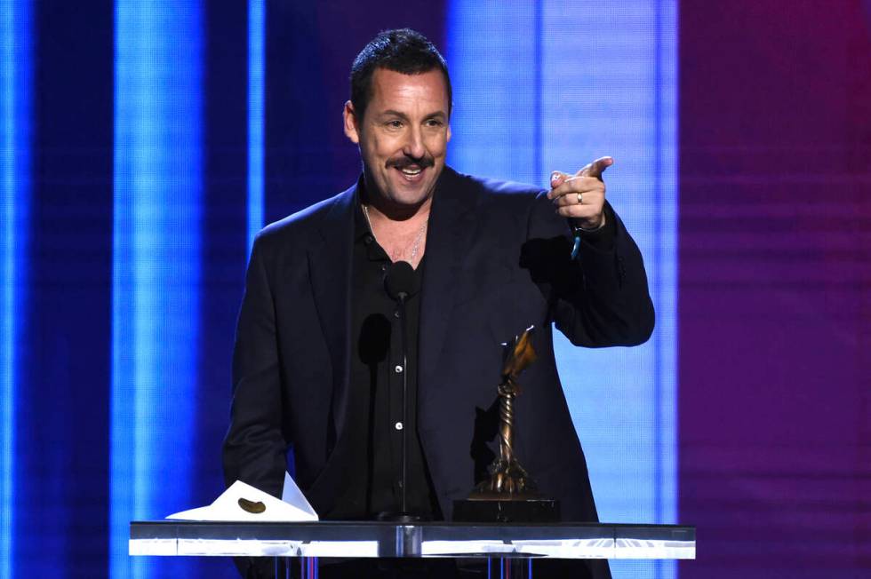 Adam Sandler accepts the award for best male lead for "Uncut Gems" at the 35th Film I ...