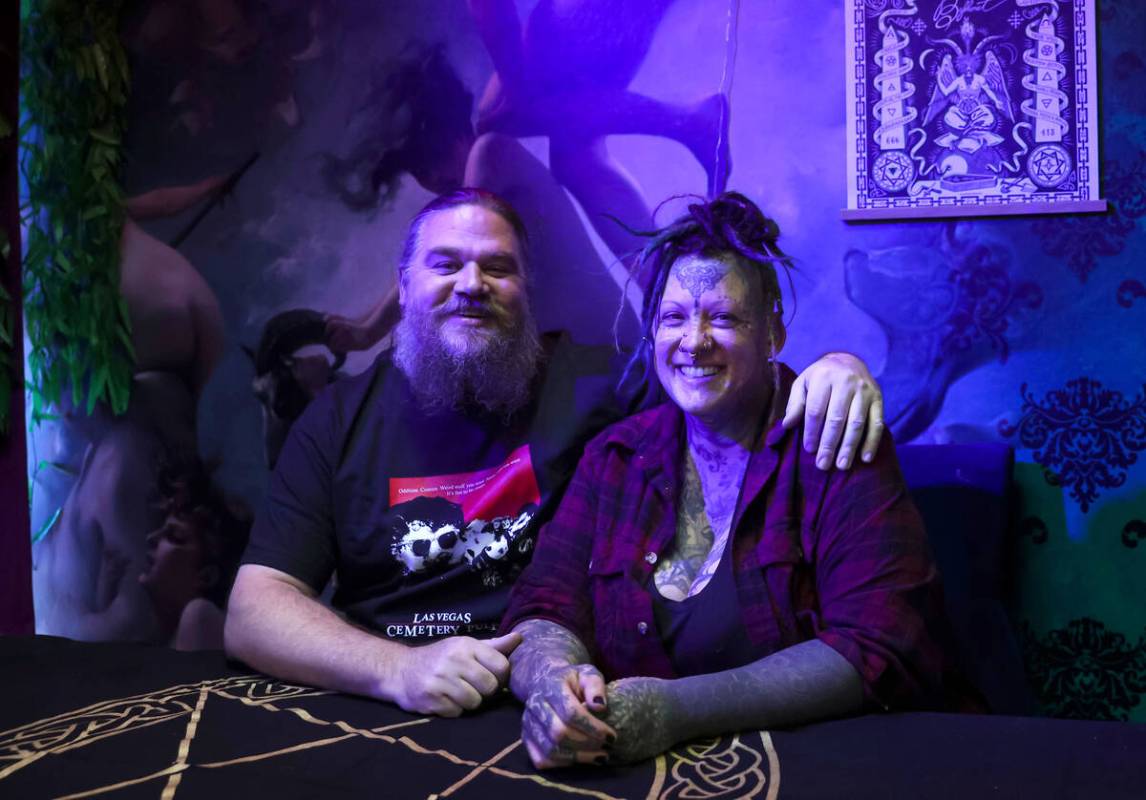 Chris Kmit, left, and Erin Kmit pose for a portrait at their store Cemetery Pulp, a shop of odd ...