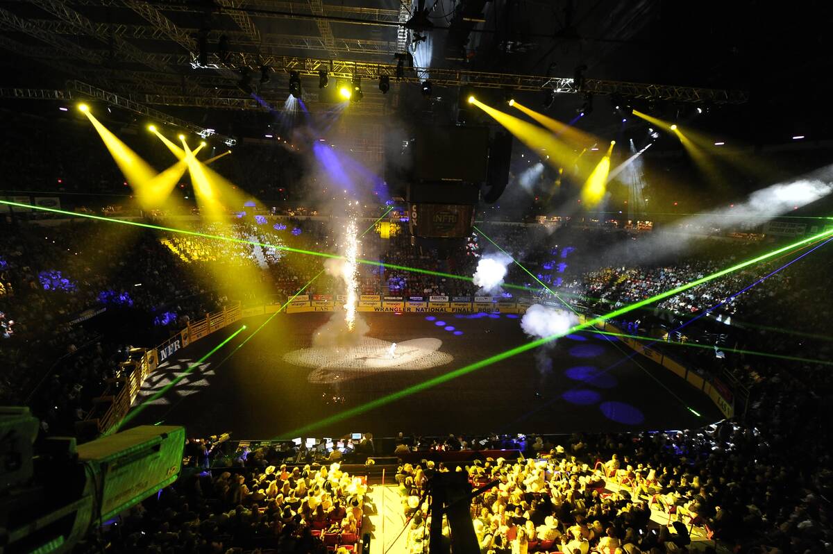 Lasers and pyrotechnics are seen prior at the National Finals Rodeo at the Thomas & Mack Center ...