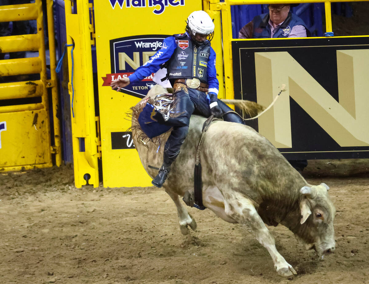 Stetson Wright, of Milford, Utah, competes in bull riding during the first night of the Nation ...