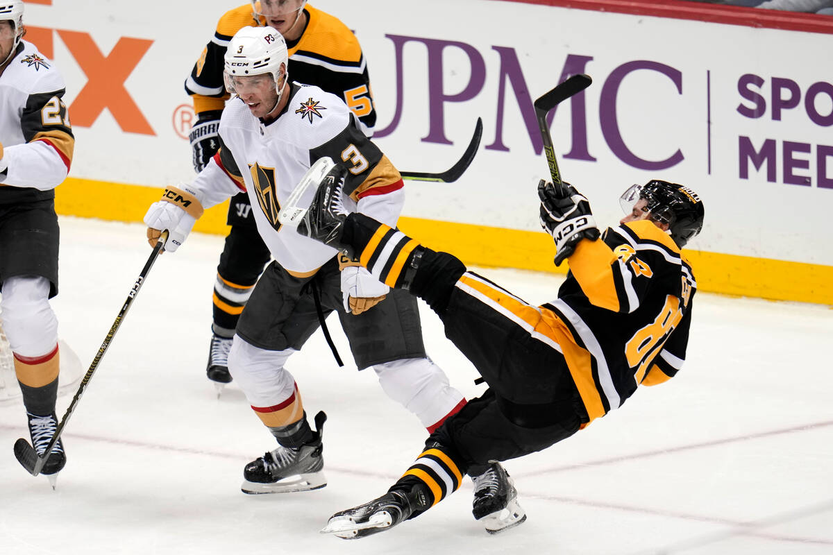 Pittsburgh Penguins' Sidney Crosby (87) is checked off his skates by Vegas Golden Knights' Bray ...