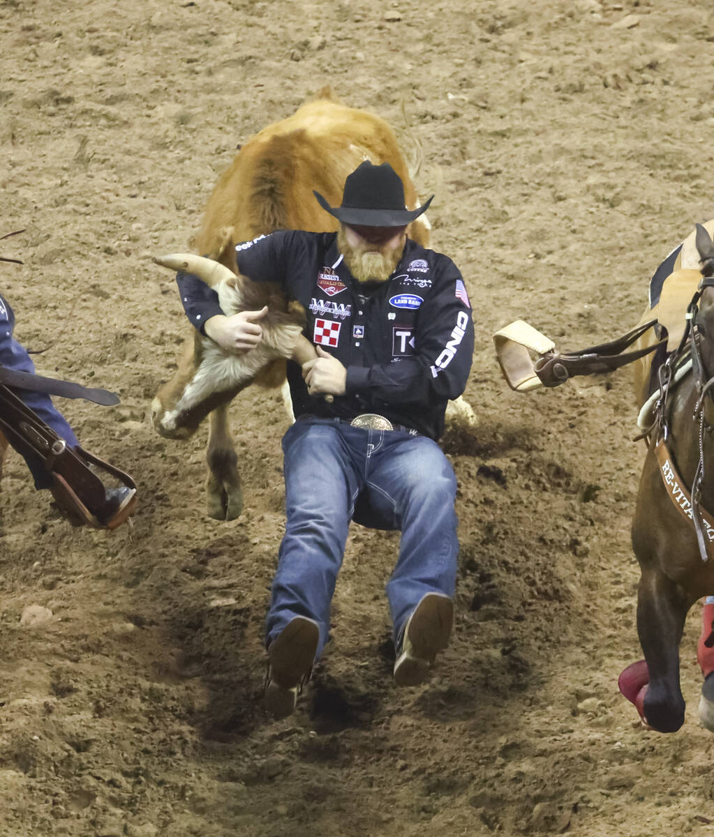 Will Lummus, of Byhalia, Miss., competes in steer wrestling during the first night of the Natio ...