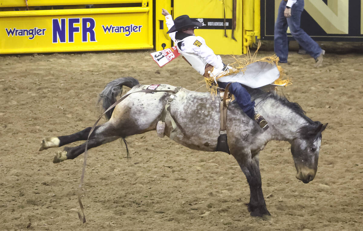 Kaycee Feild, of Genola, Utah, competes in bareback riding during the first night of the Nation ...