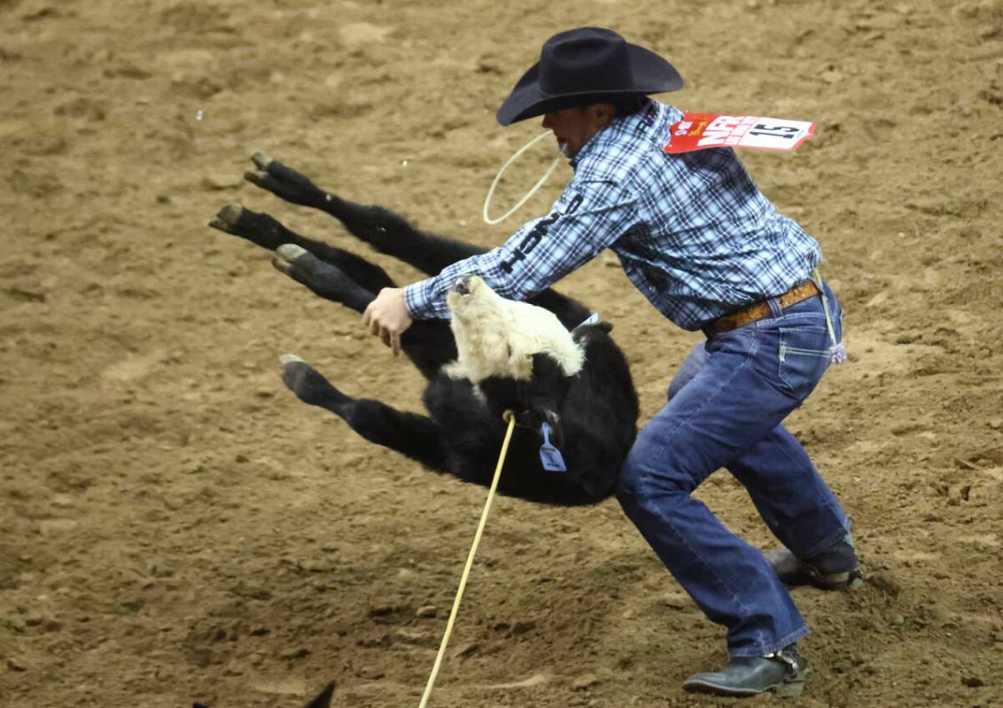 Caleb Smidt, Bellville, Texas, competes in tie-down roping during the first night of the Nation ...