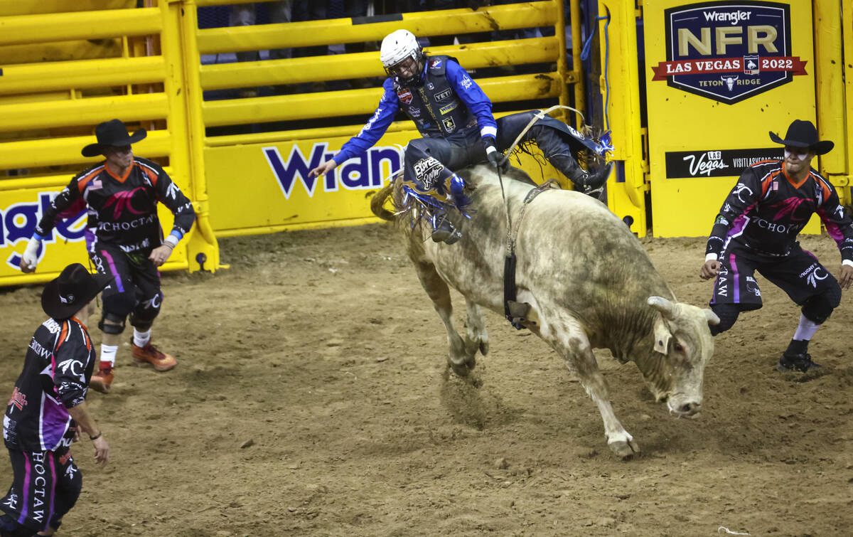 Stetson Wright, of Milford, Utah, competes in bull riding during the first night of the Nationa ...