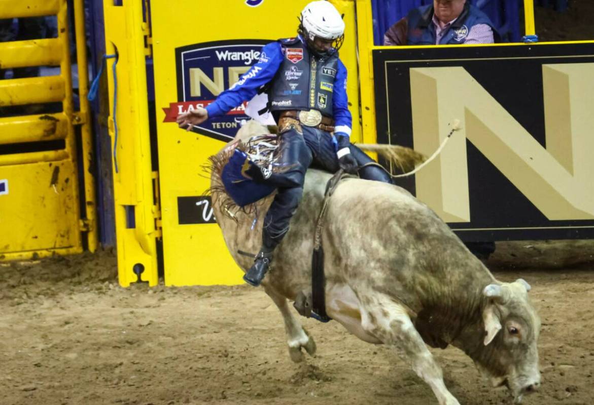 Stetson Wright, of Milford, Utah, competes in bull riding during the first night of the Nationa ...