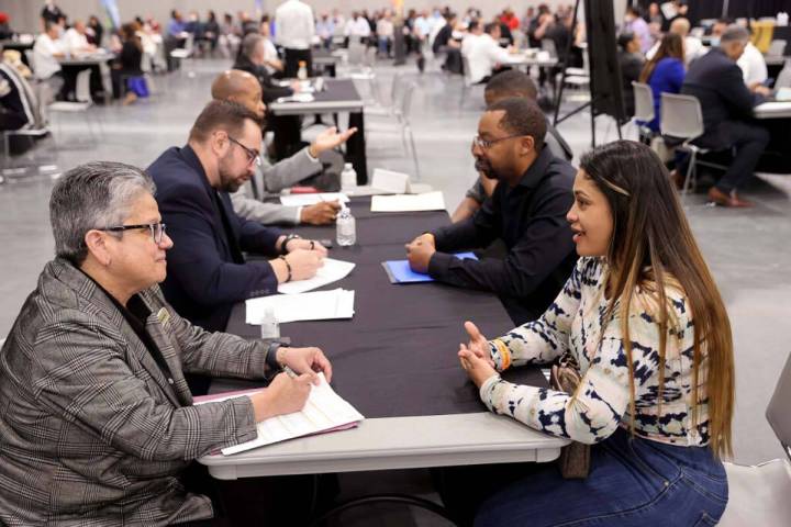 Annette Machuca, security manager with MGM Grand, left, talks to Elina Pachon of Las Vegas duri ...