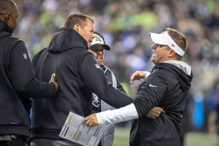 Raiders head coach Josh McDaniels, right, celebrates the team’s overtime win over the Se ...