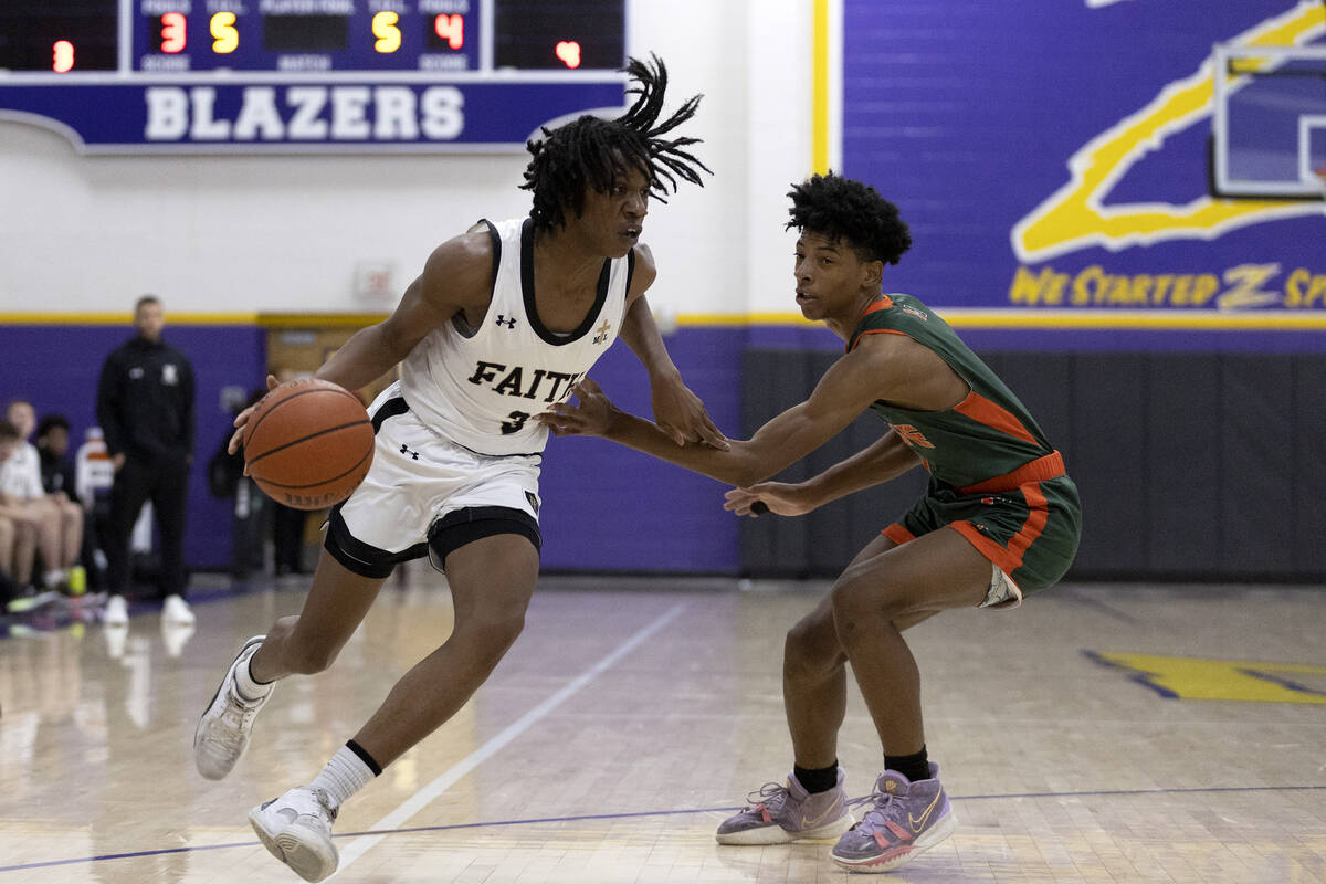 Faith Lutheran’s JohnPaul Agu (3) drives around Mojave’s Zaccarion Jackson, right ...